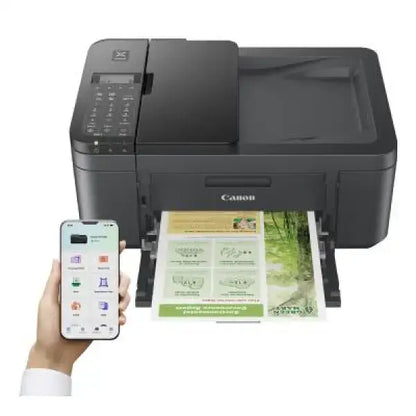 Stampante Canon multifunzione nera wireless con scanner e stampa a colori da smartphone in uso