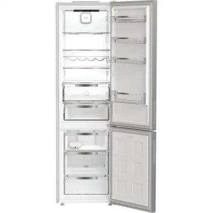 Frigo combinato Hotpoint bianco con porta aperta e cassetti interni spaziosi