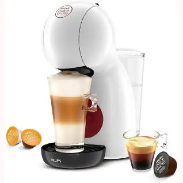 Macchina da caffè Krups bianca con tazza di cappuccino e capsule di caffè colorate